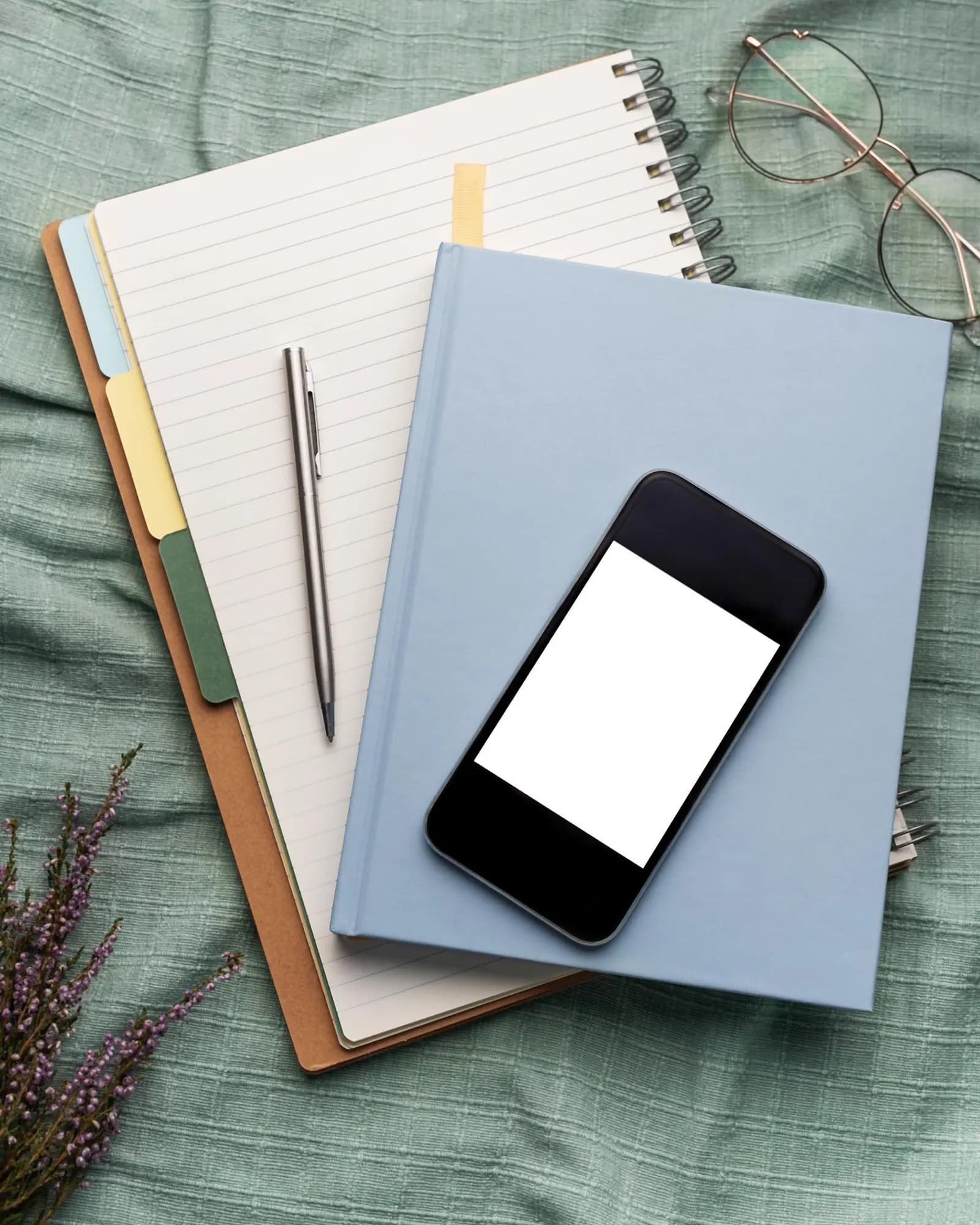 A phone and campaign materials arranged on a desk.