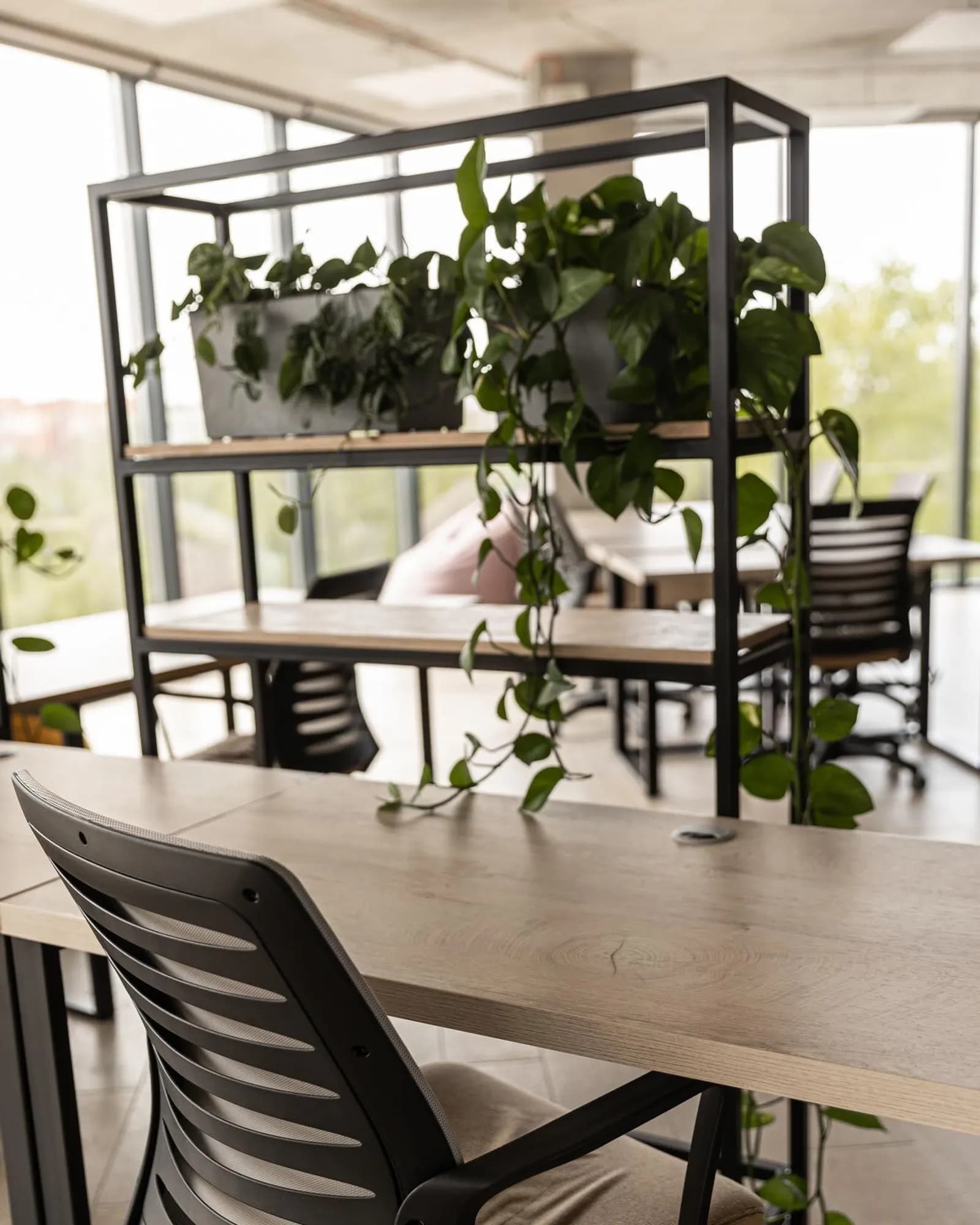 An empty creative workspace with tables and chairs.